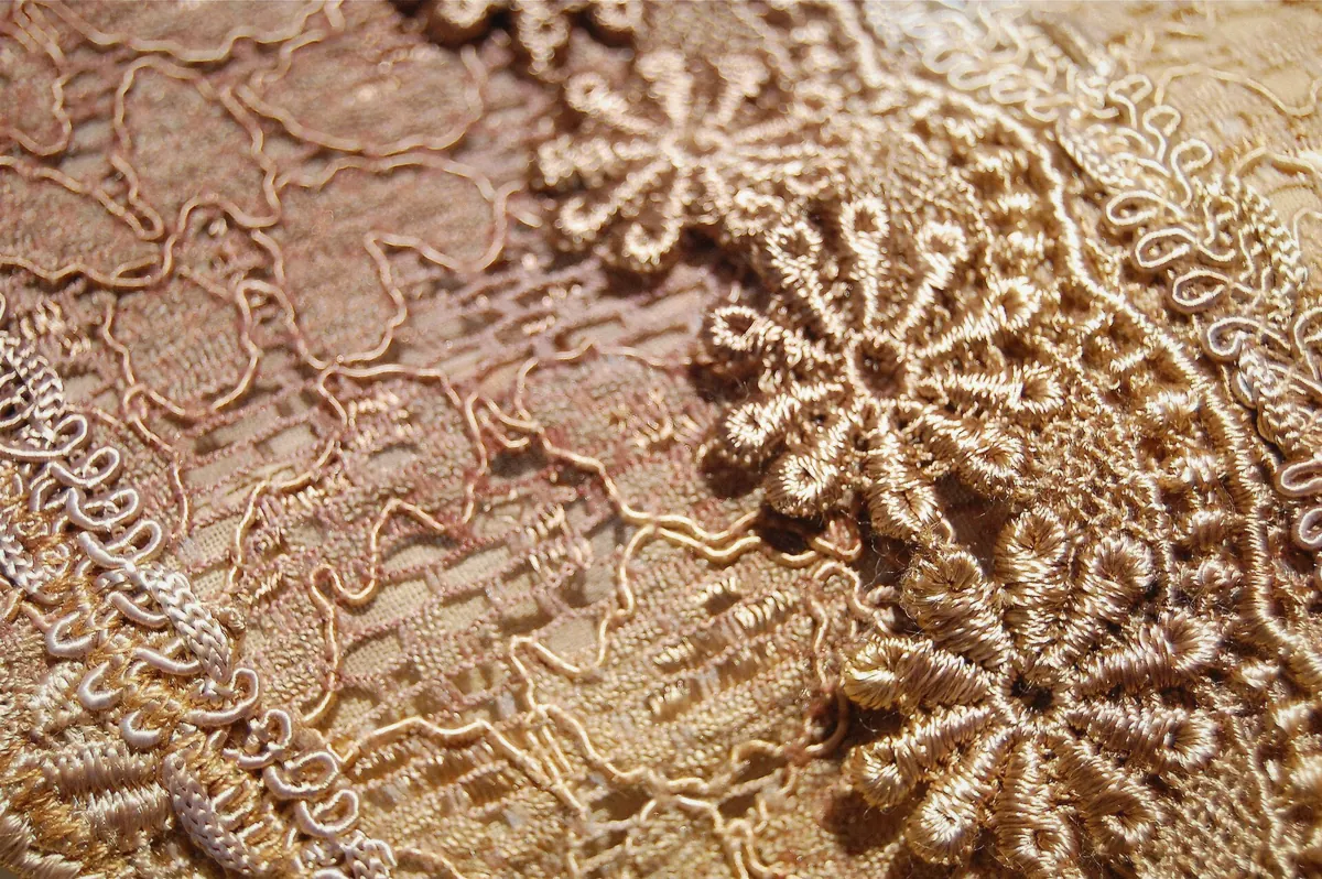Close view of handmade Burano lace worked on a cushion, the craft behind the Lace Museum on the extended option