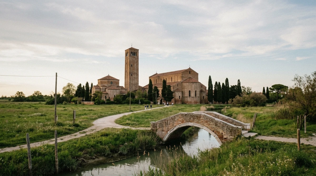Santa Maria Assunta basilica on quiet Torcello across its meadow, the lagoon's oldest church